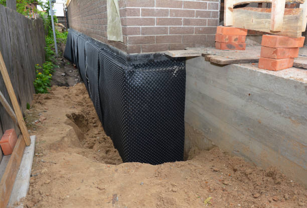 Happy homeowners after waterproofing job in Summit